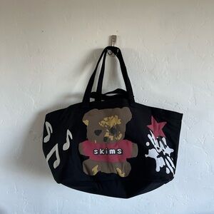 SKIMS x CACTUS PLANT FLEA MARKET Black Tote with Pink Star Design